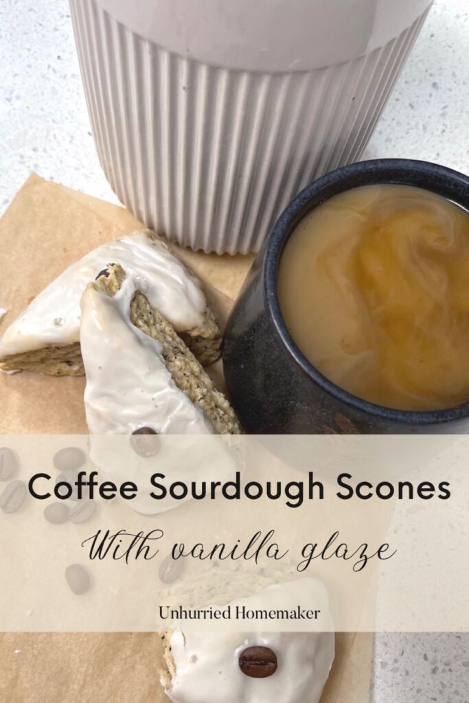 A small pile of coffee sourdough scones next to a swirling cup of coffee.