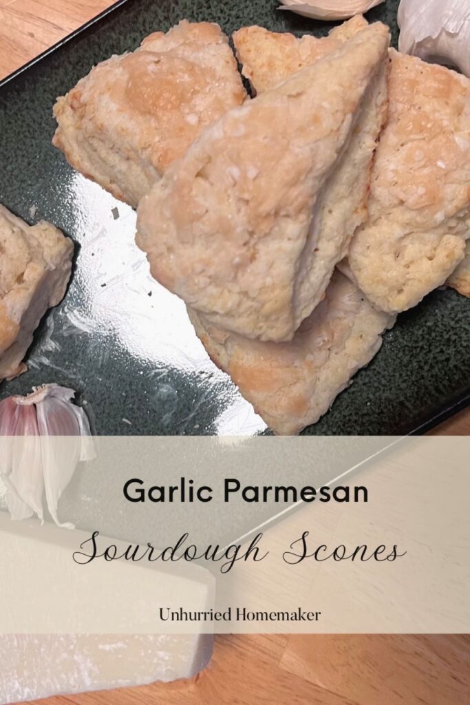A small pile of garlic parmesan sourdough scones by the unhurried homemaker.