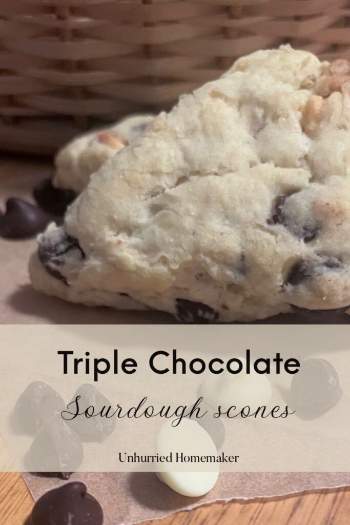 A triple chocolate sourdough scone in front of a basket made by the unhurried homekaer