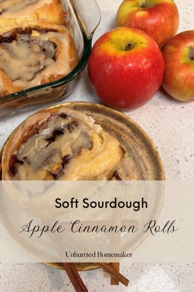 Soft sourdough apple cinnamon rolls on a plate made by unhurried homemaker.