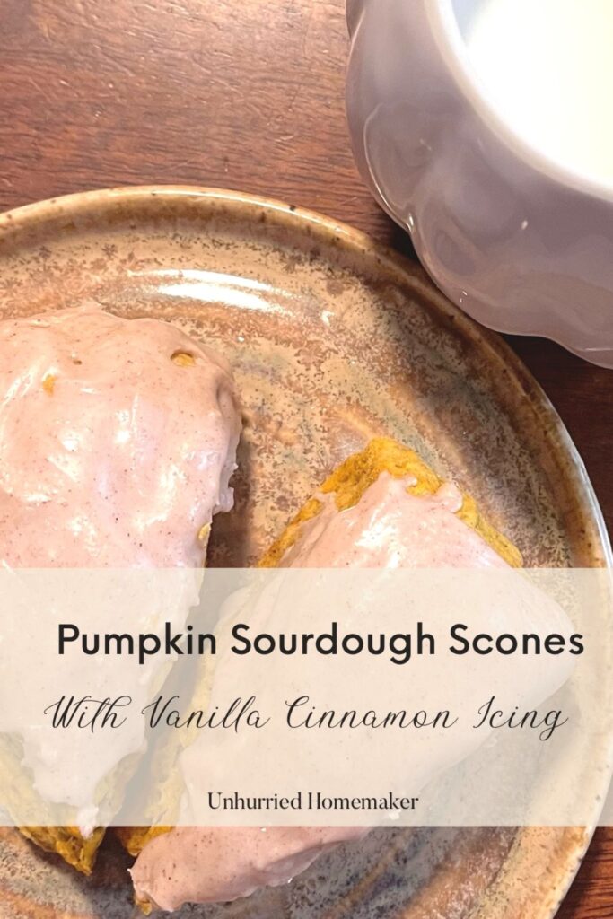 A plate of pumpkin sourdough scones with vanilla cinnamon icing made by the unhurried homemaker.
