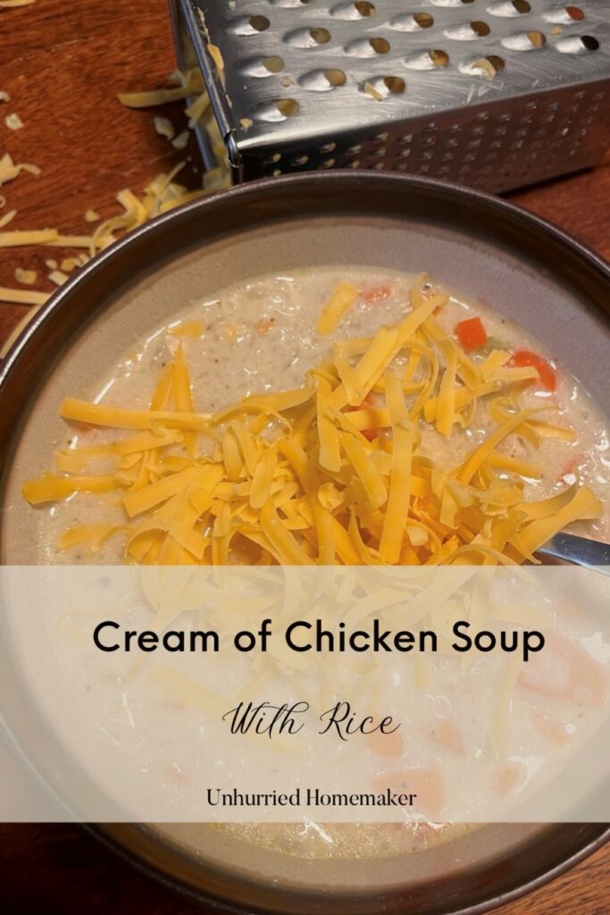 Cream of chicken soup with rice made by the unhurried homemaker and topped with cheddar cheese.